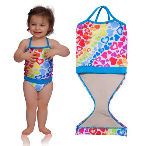 FASTEN rainbow hearts swimsuit for girls. Sizes 6m - 5. UPF 50 sun protection. Patented design that opens at the waist, making diaper changes and bathroom breaks faster and easier. Perfect for potty training! Cross-back design with hearts pattern. 
